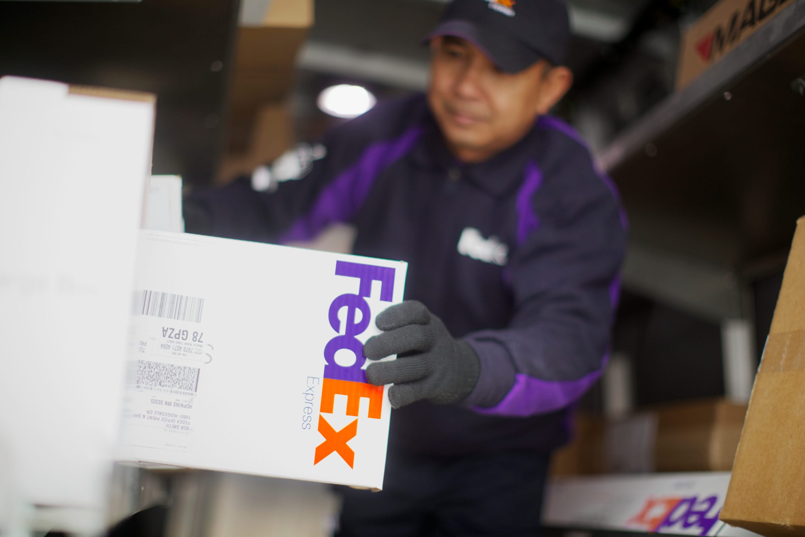 FedEx worker handling shipment